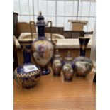 AN ASSORTMENT OF BLUE AND GILT CERAMIC ITEMS TO INCLUDE BUD VASES AND AN URN ETC
