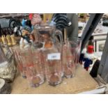 A LEMONADE SET TO INCLUDE A JUG WITH RED DETAIL AND SIX TUMBLERS