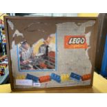 A VINTAGE LEGO SET IN A WOODEN STORAGE BOX