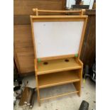 A CHILDRENS DRAWING BOARD AND TABLE