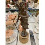 A METAL STATUE OF CUPID ON A WOODEN PLINTH WITH NAME 'PAPILLON' HEIGHT 40CM