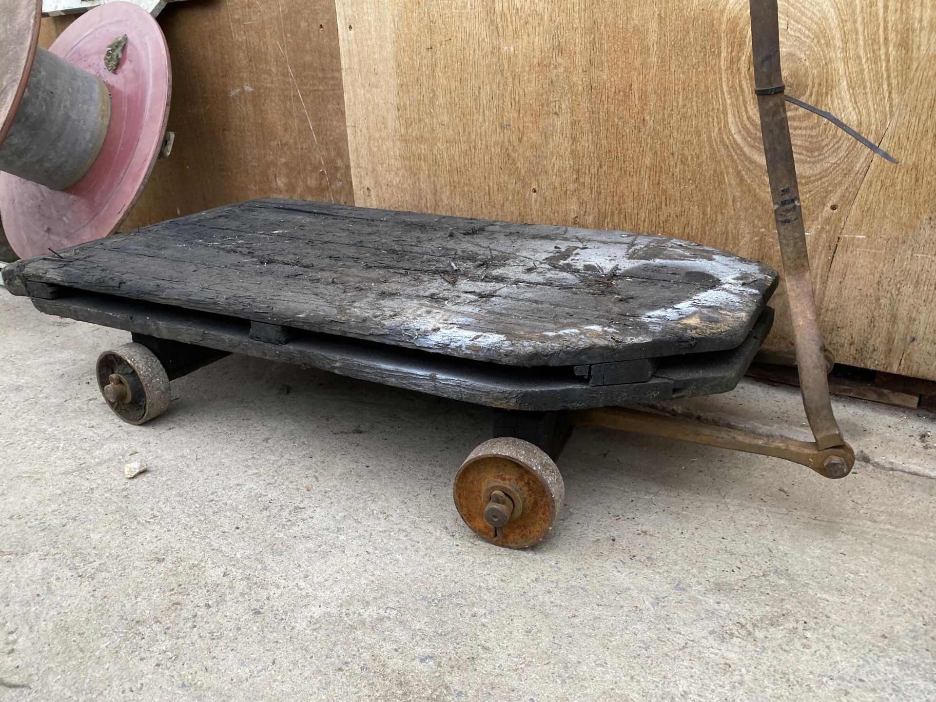 A VINTAGE CAST IRON AND WOODEN PLANK FOUR WHEELED TROLLEY - Image 4 of 5