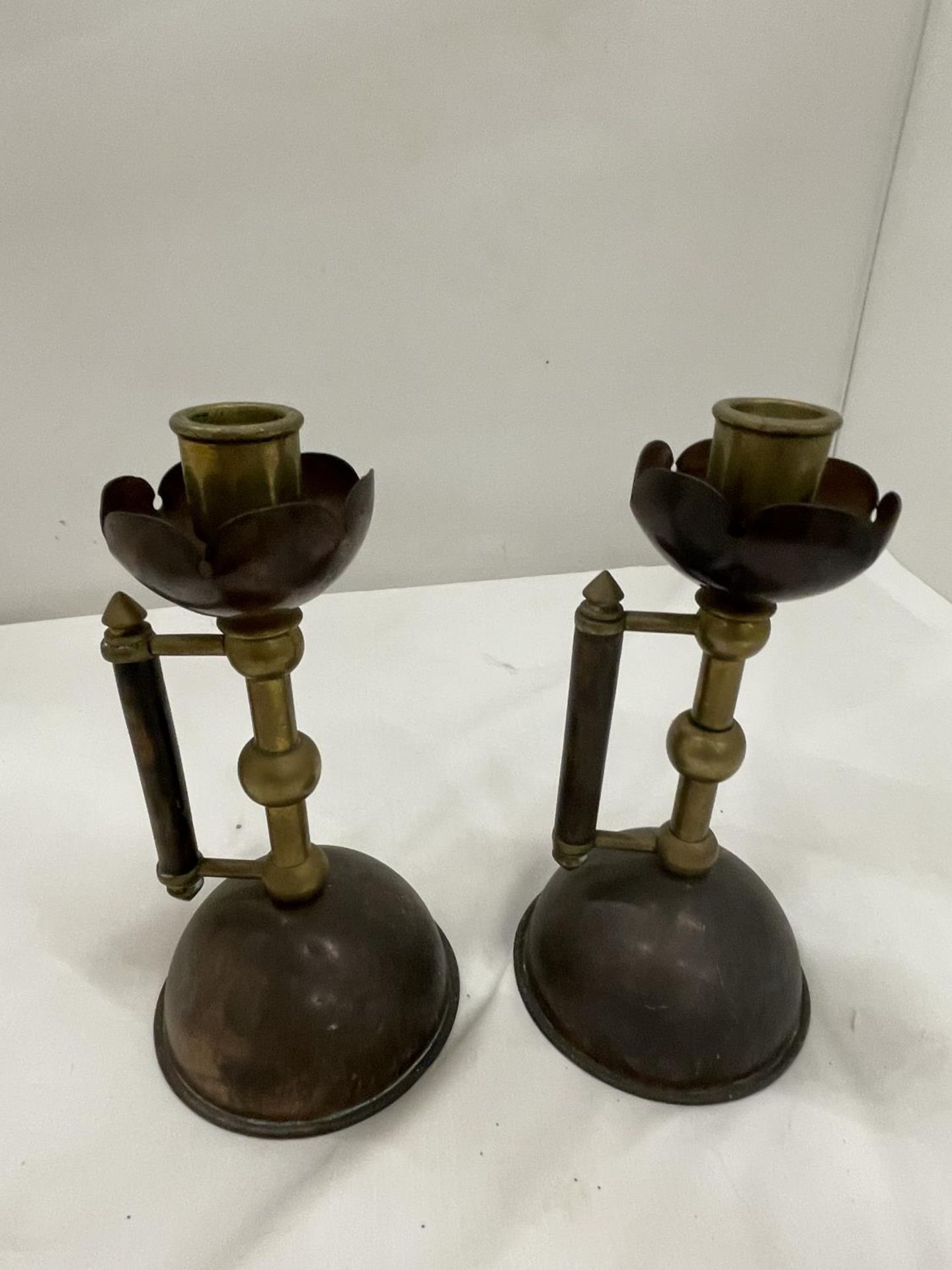 A PAIR OF COPPER AND BRASS CANDLESTICKS IN THE STYLE OF CHRISTOPHER DRESSER - Image 3 of 4