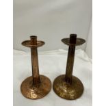 A PAIR OF COPPER ARTS AND CRAFTS CANDLESTICKS HEIGHT 23M