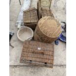 THREE WICKER BASKETS AND A MATERIAL POUFFE