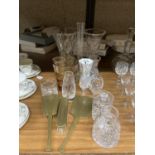 A QUANTITY OF GLASSWARE TO INCLUDE CUT GLASS VASES, LIDDED OT, BASKET, BRUSH SET, ETC