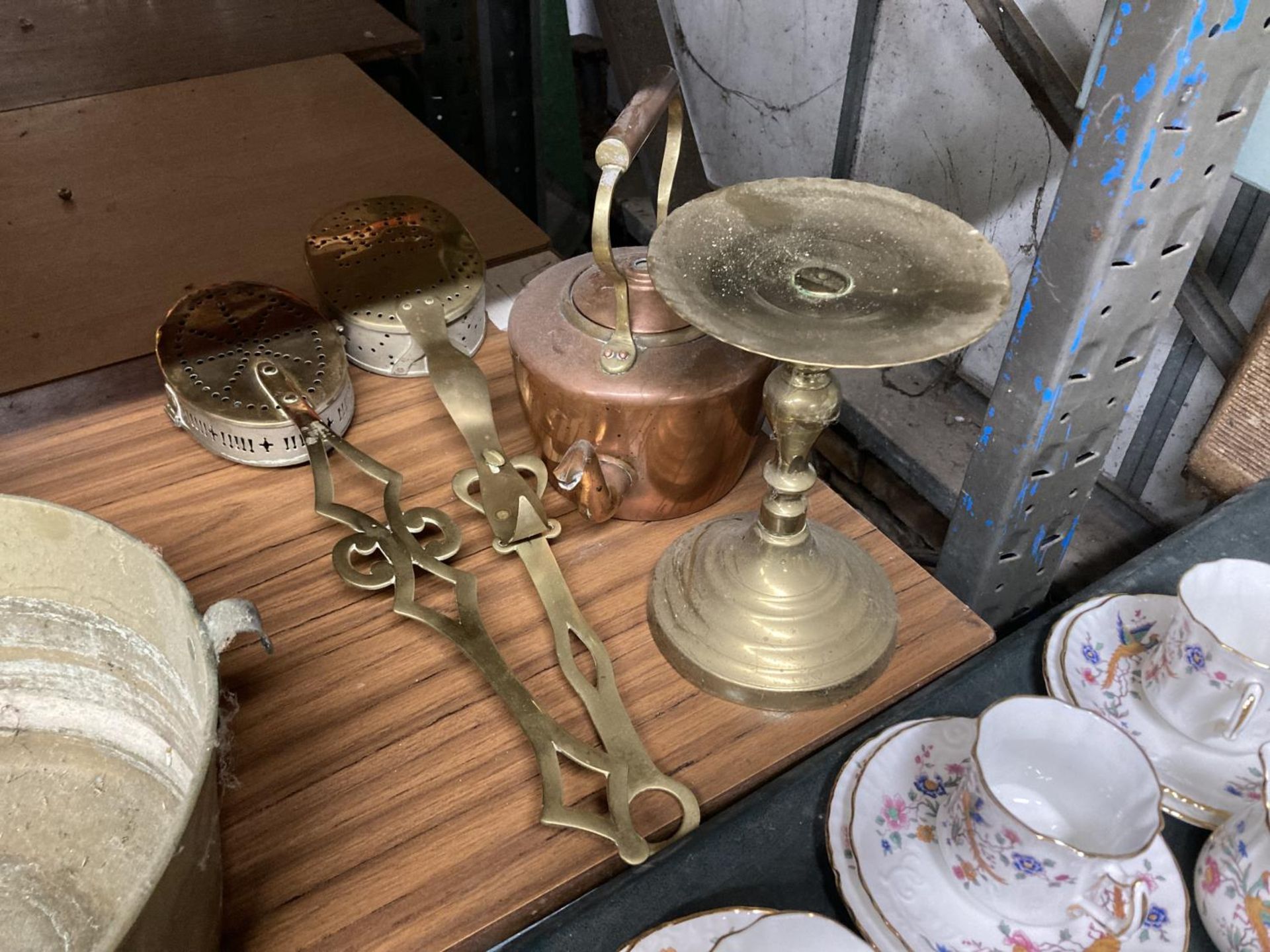 TWO BRASS CHESTNUT ROASTERS A BRASS TRIVET AND A COPPER KETTLE