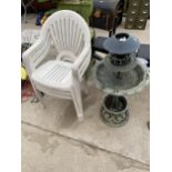 A PLASTIC BIRD TABLE AND THREE PLASTIC GARDEN STACKING CHAIRS