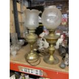 TWO VINTAGE BRASS OIL LAMPS WITH ETCHED GLASS SHADES - ONE HAS BEEN CONVERTED TO ELECTRICITY