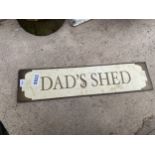 A METAL 'DAD'S SHED' SIGN