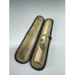 A CASED BONE CHEROOT HOLDER WITH A MONKEY DESIGN