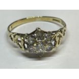 A HALLMARKED BIRMINGHAM 1987 9CT GOLD CLUSTER RING WITH A CUBIC ZIRCONIA STONE SET SIZE K IN A