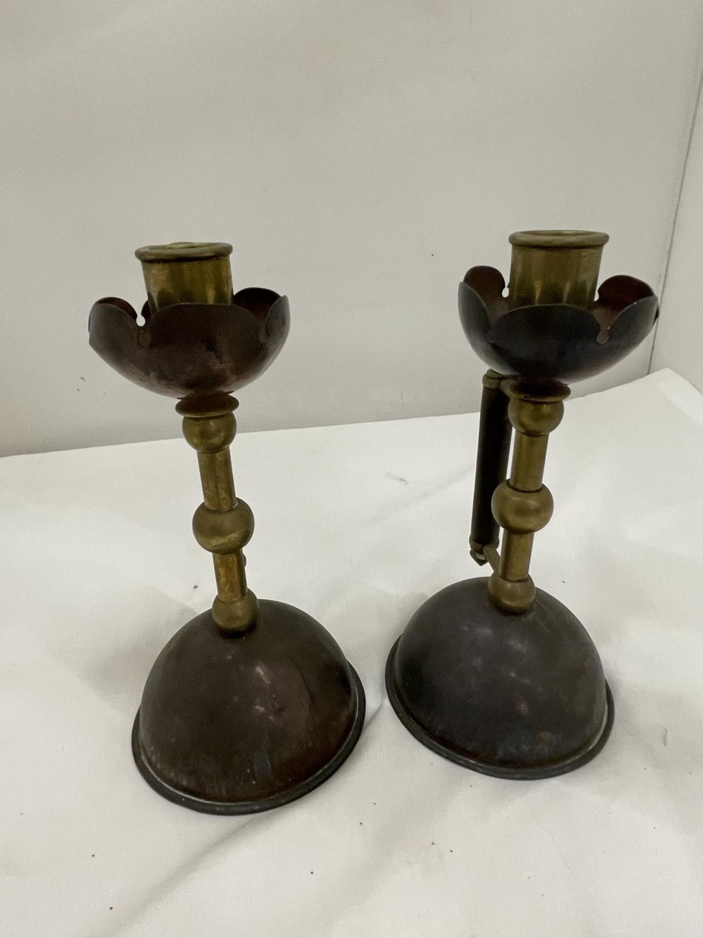 A PAIR OF COPPER AND BRASS CANDLESTICKS IN THE STYLE OF CHRISTOPHER DRESSER - Image 2 of 4