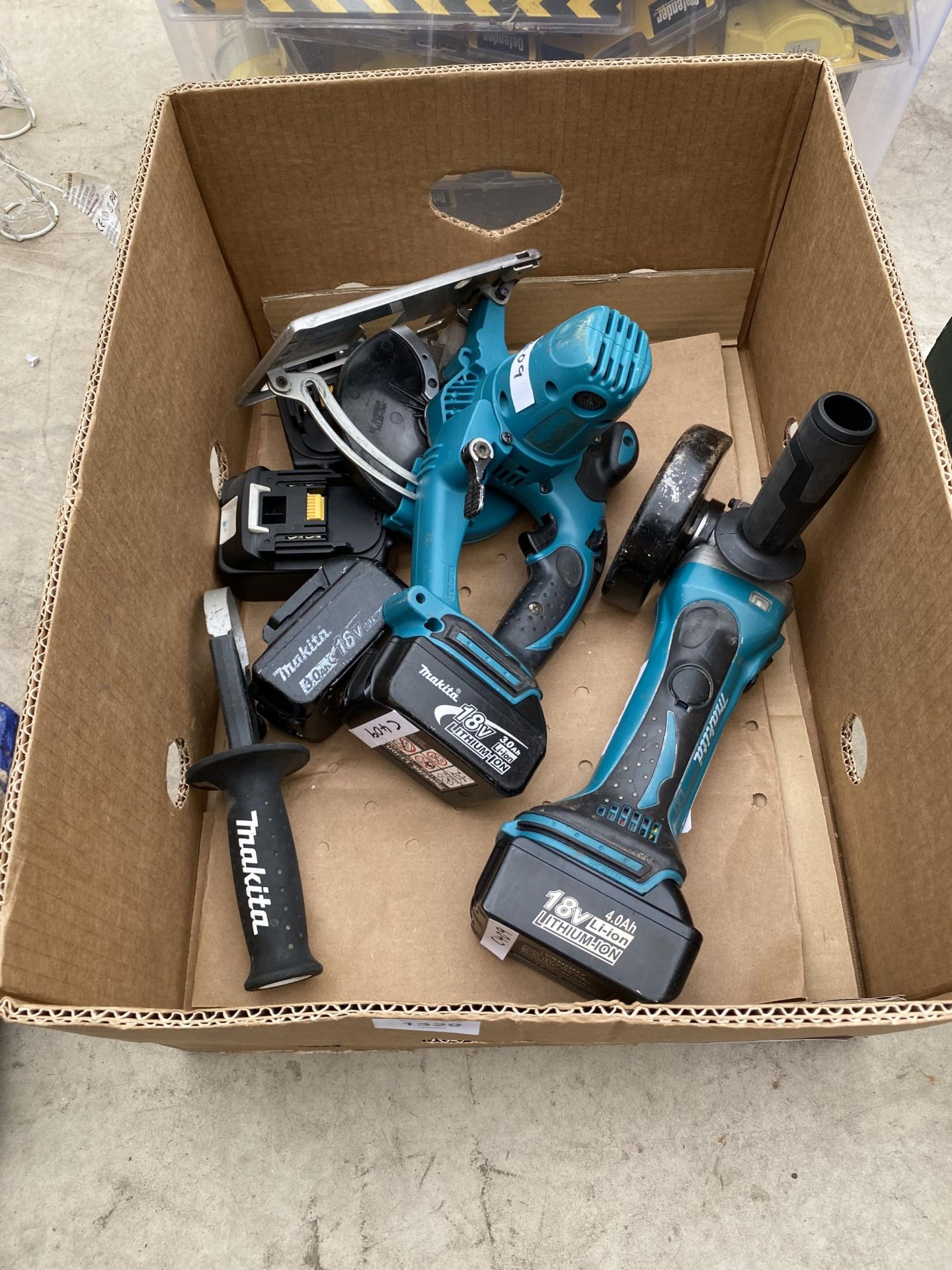 A MAKITA BATTERY GRINDER, A MAKITA CIRCULAR SAW AND FIVE BATTERIES