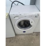 A WHITE CANDY WASHING MACHINE BELIEVED IN WORKING ORDER BUT NO WARRANTY