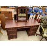 A HAMMONDS OF ENGLAND TWIN PEDESTAL DRESSING TABLE WITH SEVEN DRAWERS AND BARLEYTWIST MIRROR, 53"