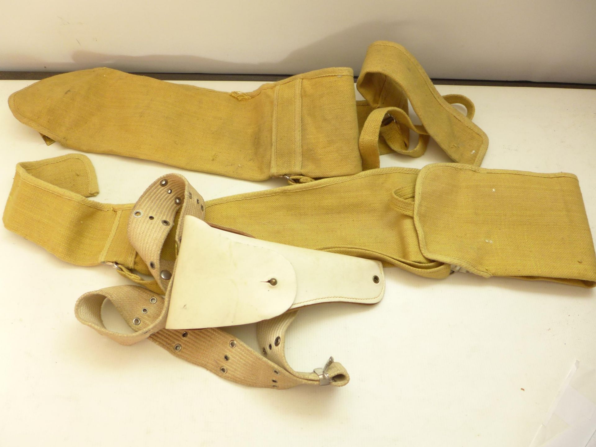 A WHITE LEATHER JAY-PEE HOLSTER AND BELT, TWO CANVAS GUN SLIPS (3)