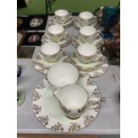A ROYAL TRON TEASET IN PALE GREEN AND GILT TO INCLUDE A CAKE PLATE, SUGAR BOWL, CREAM JUG, CUPS,