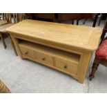 A MODERN OAK TV STAND WITH THREE DRAWER TO THE BASE, 45" WIDE