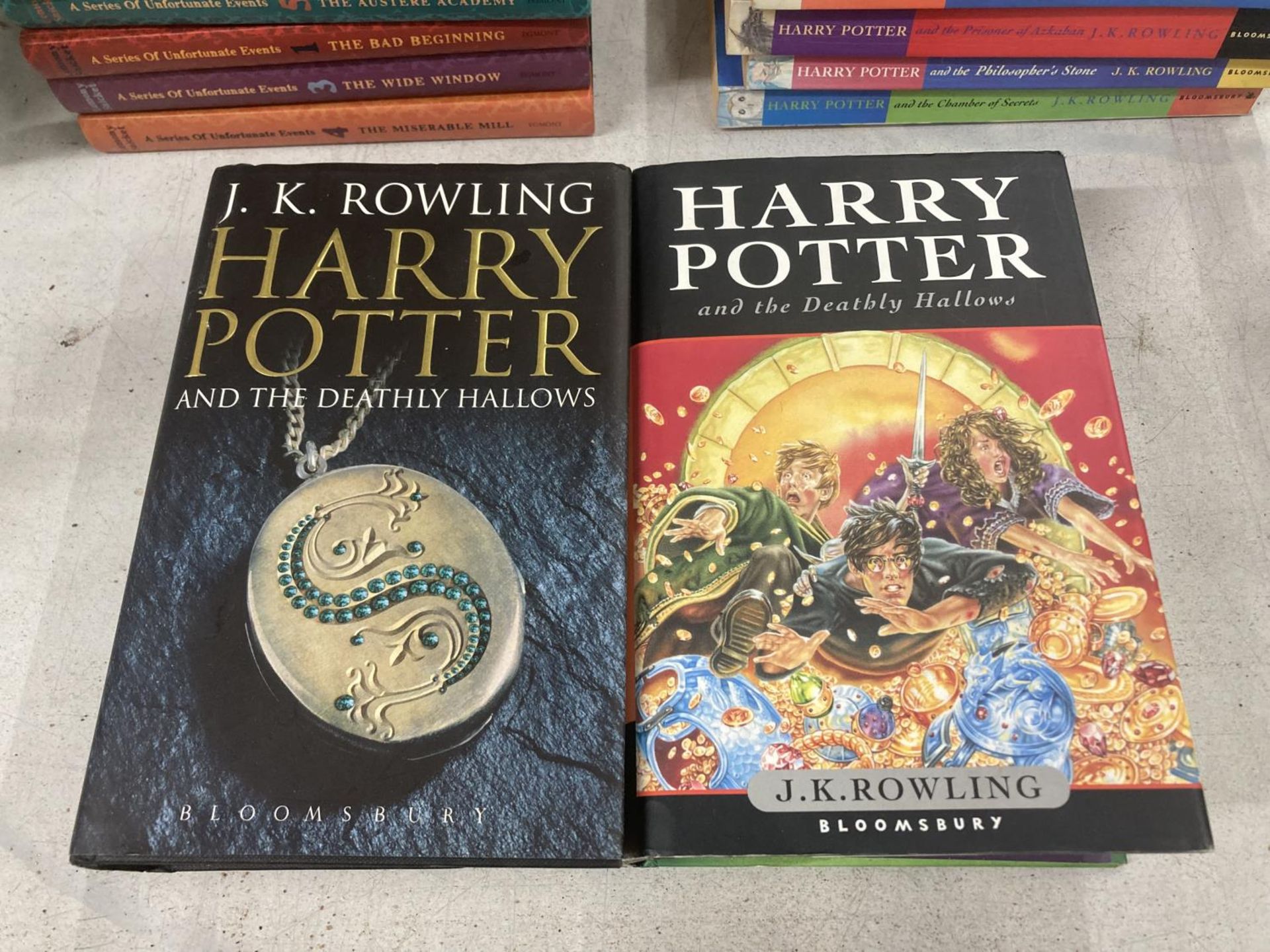 TWO FIRST EDITION HARDBACKS HARRY POTTER AND THE DEATHLY HALLOWS BY J.K ROWLING WITH DUSTOCVERS BOTH