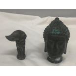 TWO POSSIBLY BRONZE ORIENTAL FIGURES WITH STAMPS TO THE BASE IN THE SHAPE OF A THAI BUDDAH AND A