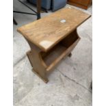 AN OAK MAGAZINE RACK/TABLE