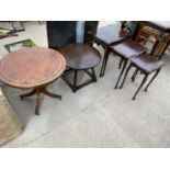 A NEST OF THREE TABLES, 22" DIAMETER, LAMP TABLE AND 24" DIAMETER TABLE WITH INSET LEATHER TOP