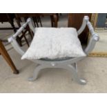 A SILVER PAINTED X-FRAME DRESSING STOOL