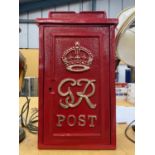 A RED WALL MOUNTED GR POST BOX WITH KEYS