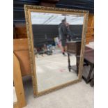 A MODERN GILT FRAMED BEVEL EDGED WALL MIRROR, 47X35"