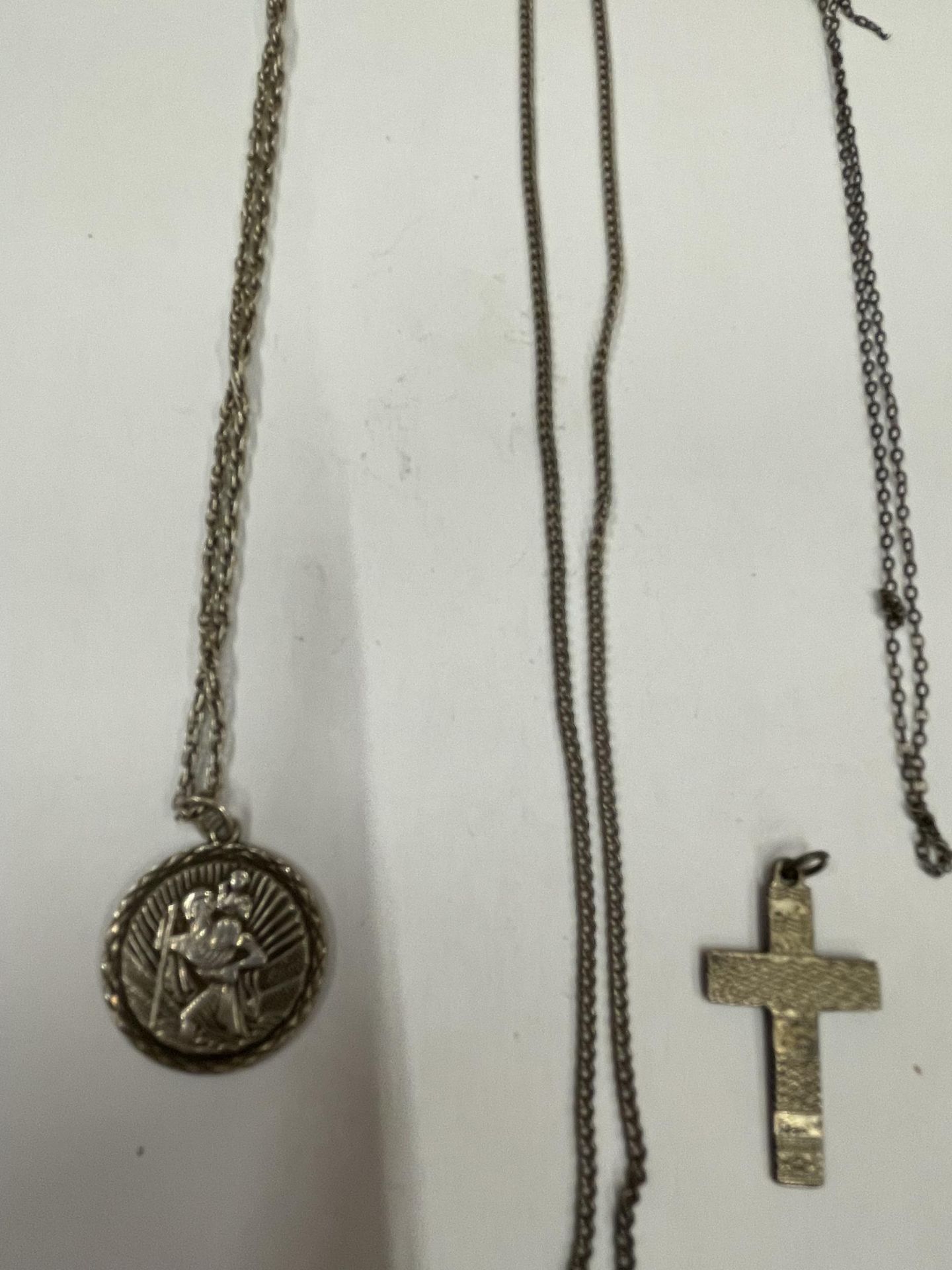 FOUR SILVER NECKLACES WITH A ST CHRISTOPHER AND A CROSS - Image 2 of 3