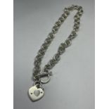 A SILVER T BAR NECKLACE WITH HEART PENDANT