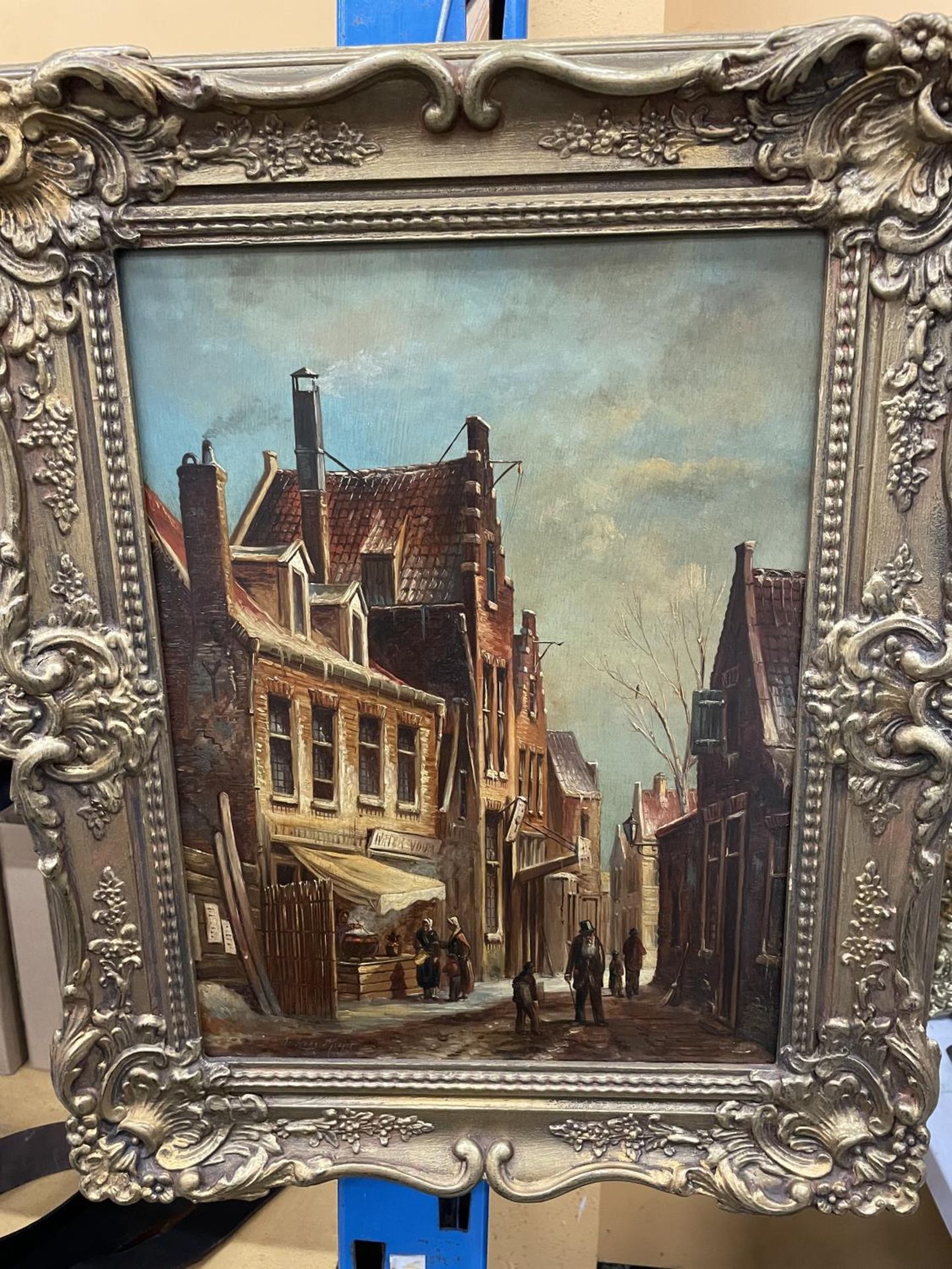 A FRAMED OIL ON BOARD OF A STREET SCENE SIGNED ANDREAS MEIJER