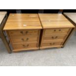 A PAIR OF MODERN PINE BEDSIDE CHESTS OF THREE DRAWERS
