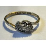 A PLATINUM RING WITH THREE IN LINE DIAMONDS SIZE L/M GROSS WEIGHT 2.01 GRAMS