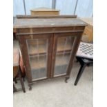 AN EARLY 20TH CENTURY BOOKCASE ON CABRIOLE LEGS 30" WIDE