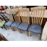 A SET OF FOUR OAK FRAMED MODERN DINING CHAIRS