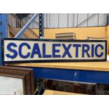 AN ILLUMINATED "SCALEXTRIC" SIGN (LENGTH 81CM, HEIGHT 18CM)