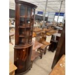 A MAHOGANY BOWFRONT CORNER CABINET