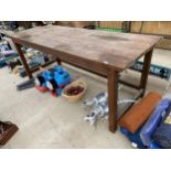 A LARGE WOODEN POTTING BENCH (L:244CM W:86CM)