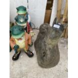 A RECONSTITTUED STONE DOG GARDEN FIGURE AND THREE RESIN TOADS