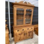 A VICTORIAN SATINWOOD TWO DOOR BOOKCASE ON BASE, 48" WIDE