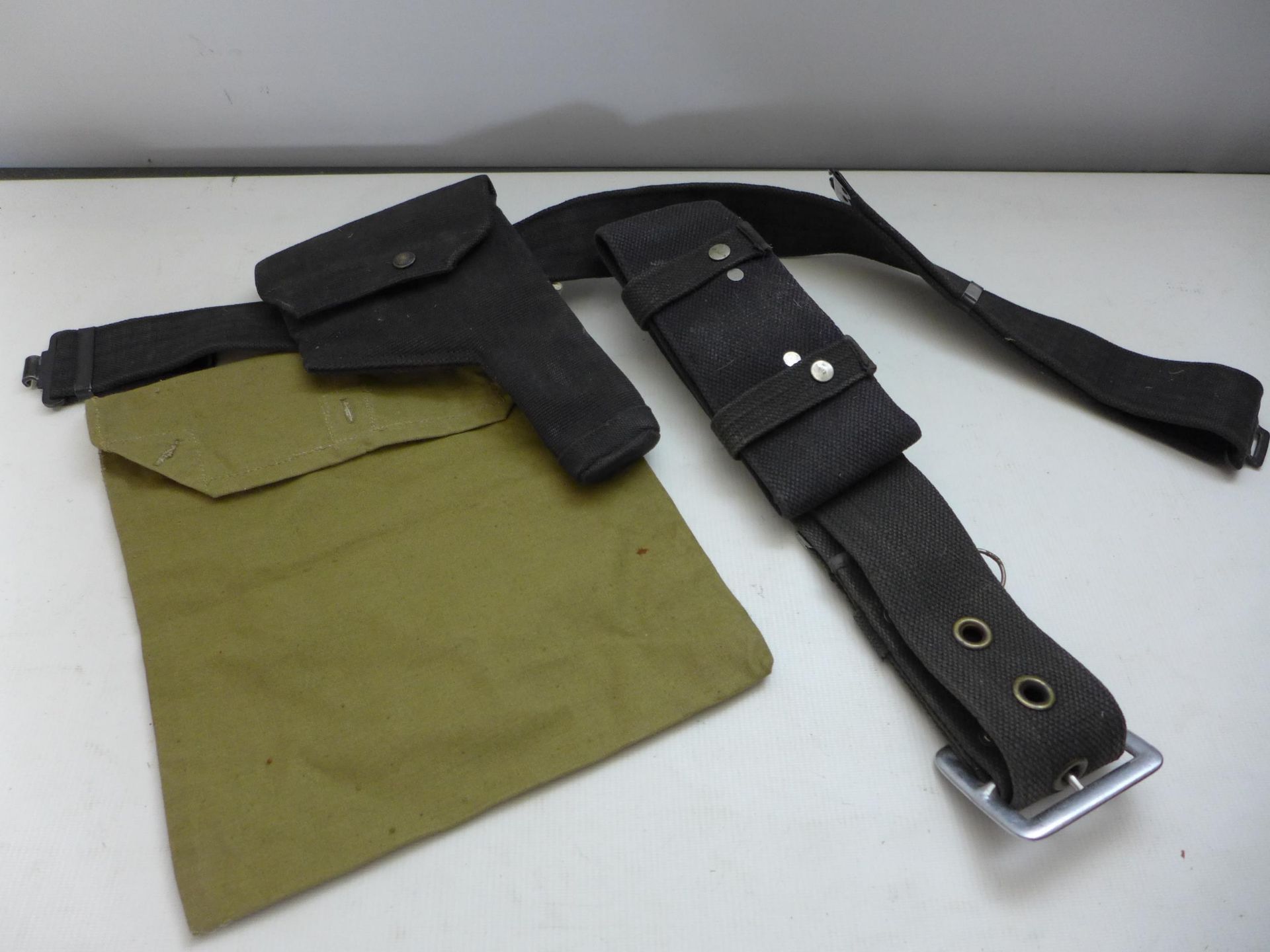 A BLACK CANVAS HOLSTER AND BELT, FURTHER BELT AND A CANVAS MAP CASE DATED 1940 (3)