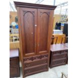 A HAMMONDS OF ENGLAND TWO DOOR WARDROBE WITH THREE SHORT AND TWO LONG DRAWERS TO THE BASE, 38" WIDE