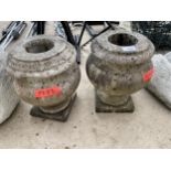 A PAIR OF CARRERA STONE URN STANDS
