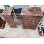 A VINTAGE CAST IRON FIRE PLACE STOVE ENCLOSING OVEN AND STOVE