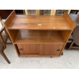 A RETRO TEAK OPEN BOOKCASE WITH TWO SLIDING DOORS TO BASE, 32" WIDE