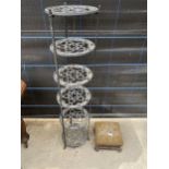 A METAL SIX TIER SAUCEPAN RACK AND SMALL STOOL