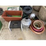 AN ASSORTMENT OF GARDEN ITEMS TO INCLUDE A FIRE BIN, PLANT POTS AND WATERING CANS ETC