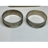 A PAIR OF HALLMARKED SILVER NAPKIN RINGS BY F.I.W & S
